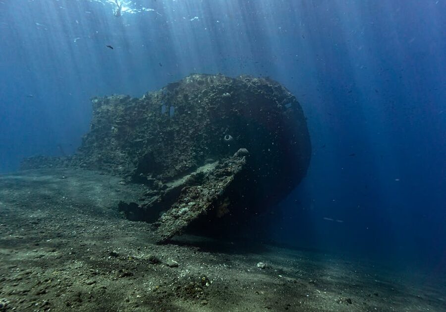 Underwater shipwreck remains with marine life