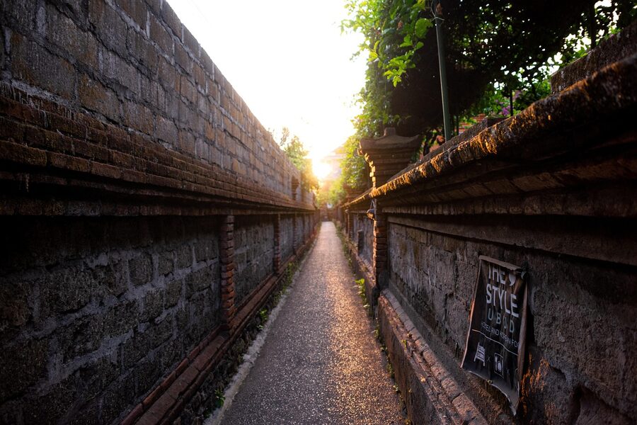 Ubud street at golden sunset with traditional architecture