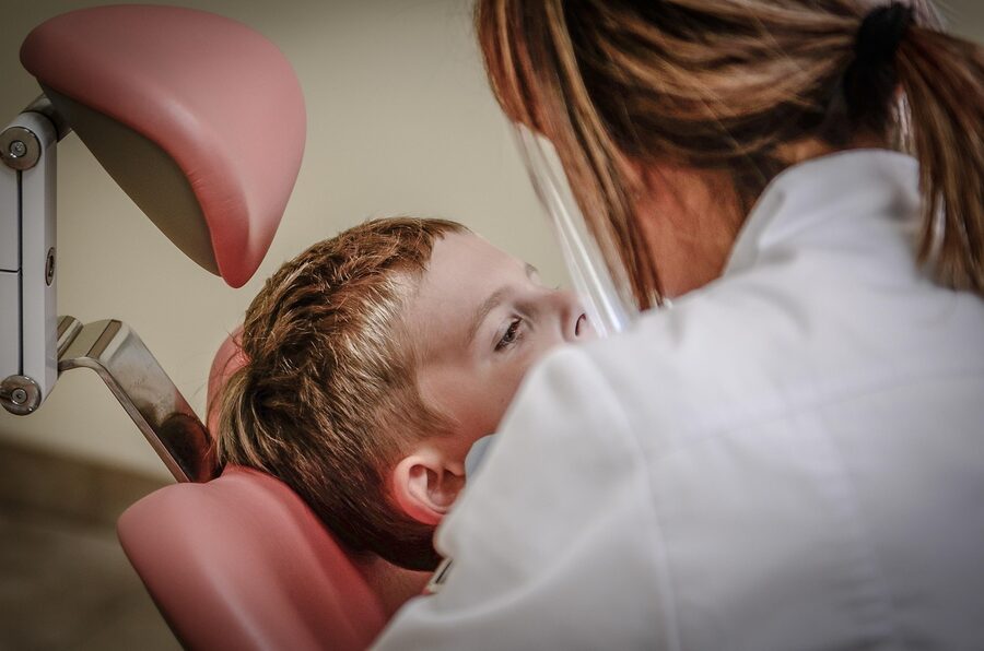 Dental clinic patient receiving routine dental check-up in a modern surgery