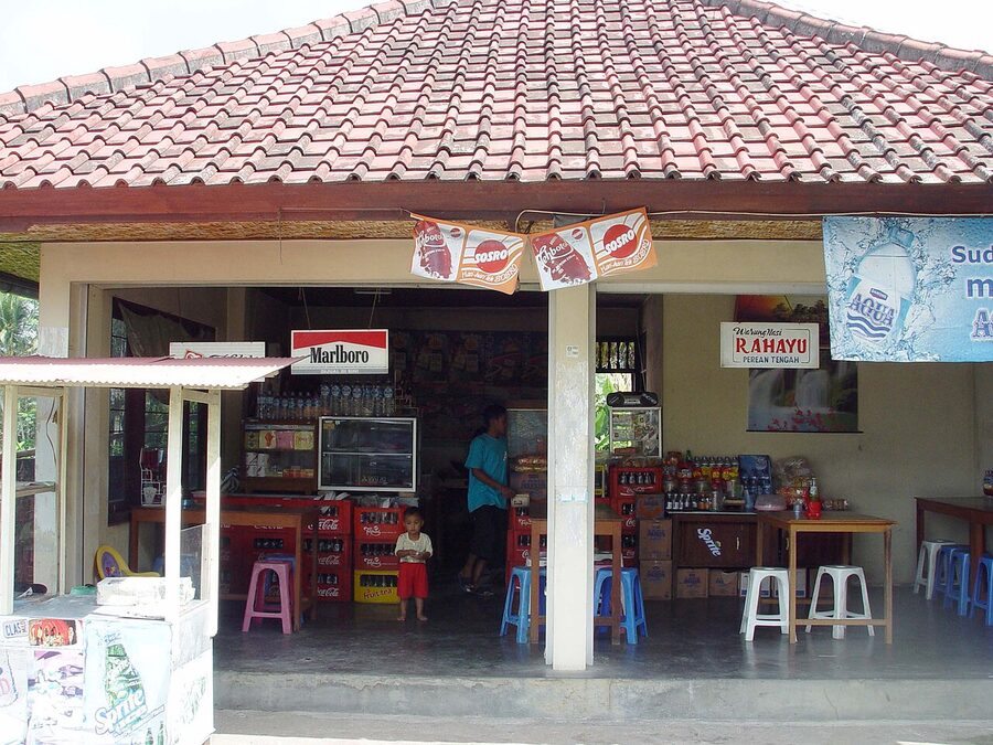 Traditional roadside warung in Bali with Bintang and Aqua signage