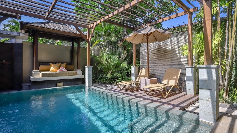 Ubud villa with Balinese architecture in lush garden