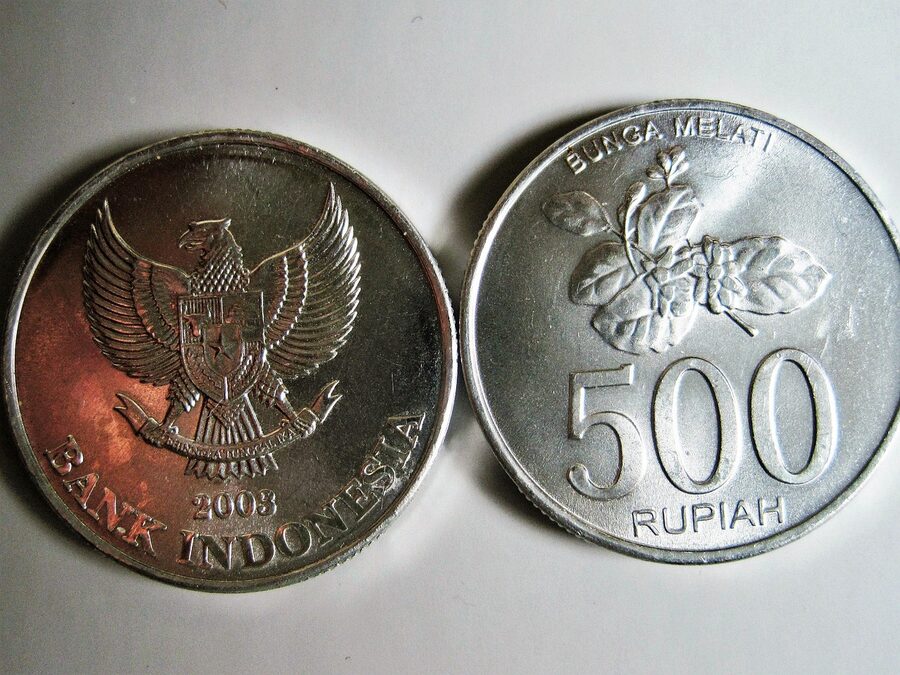 A pile of Indonesian rupiah banknotes and coins
