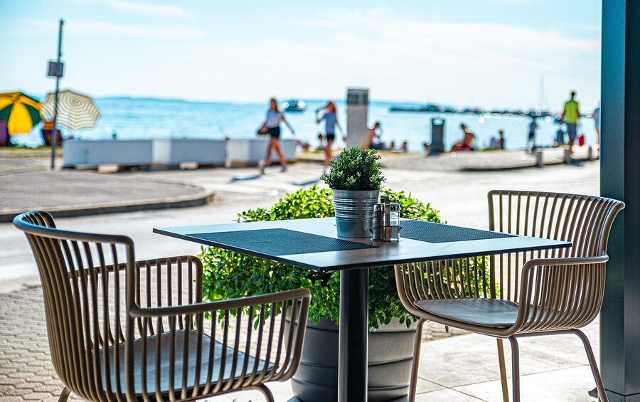 Beachfront restaurant table with sea view