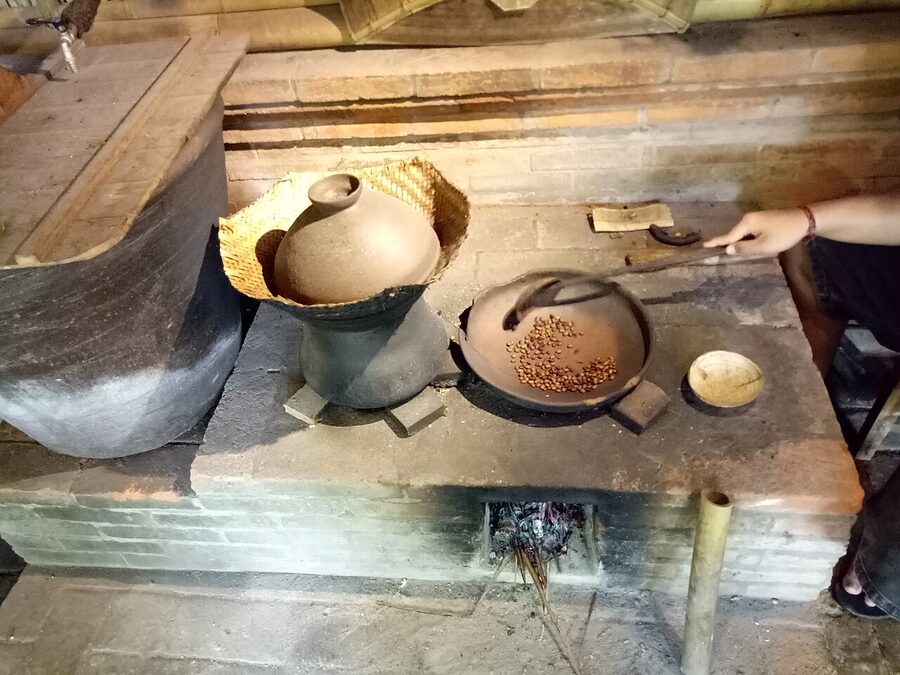 Traditional coffee bean roasting at a Bali coffee plantation