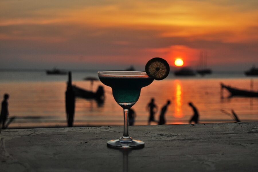 Tropical cocktail at sunset on a beach