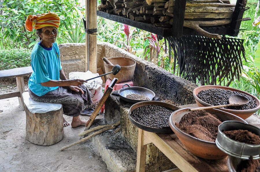 Coffee beans being hand-roasted at a Bali coffee plantation
