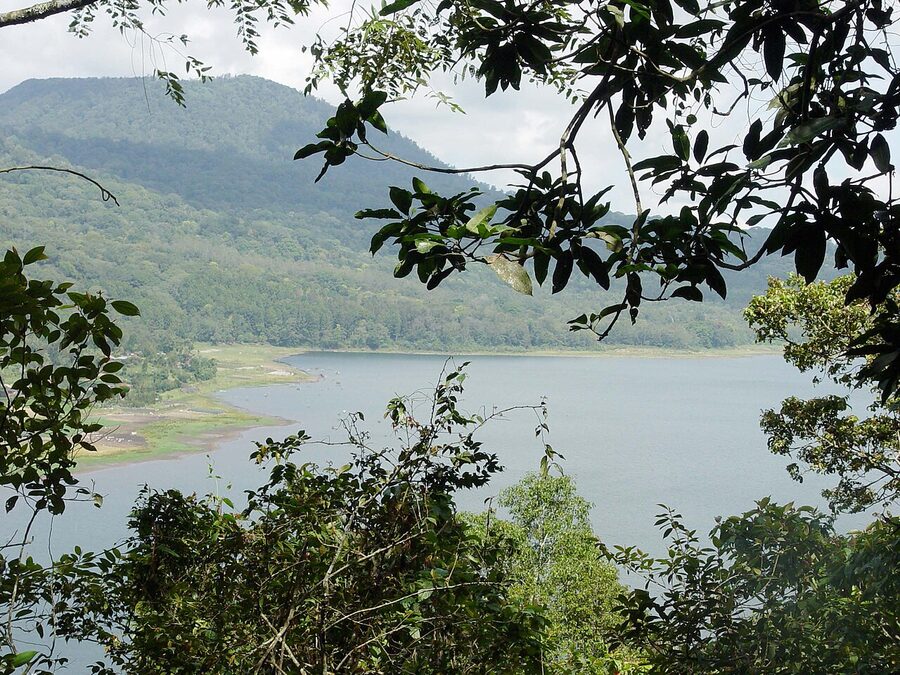 Lake Buyan seen from a forested viewpoint with surrounding ridges