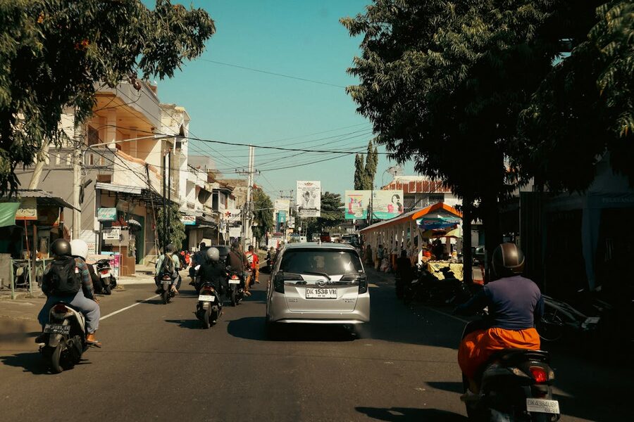 Bali traffic with mopeds and minivan in Kuta area