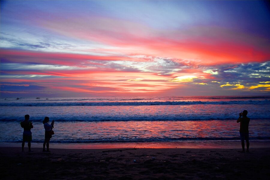 Kuta Beach sunset with red and purple sky over the ocean