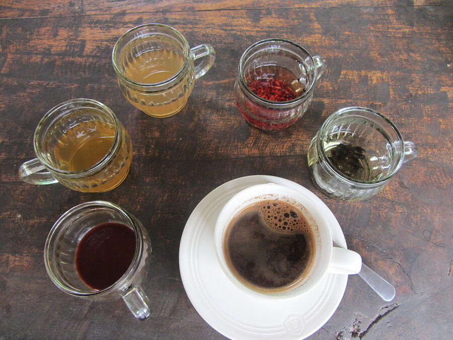 A small glass of strong Balinese coffee served on a tray