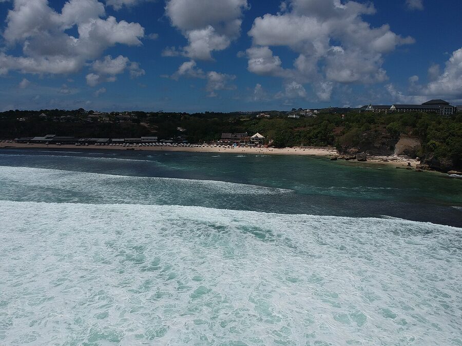 View of Balangan Beach Bali from the cliff lookout showing the long curve of white sand