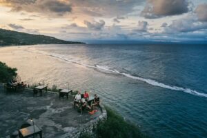 Sunset dining on a restaurant patio overlooking the sea