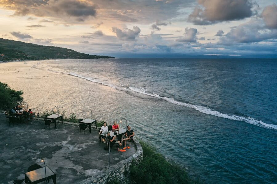 Sunset dining on a restaurant patio overlooking the sea