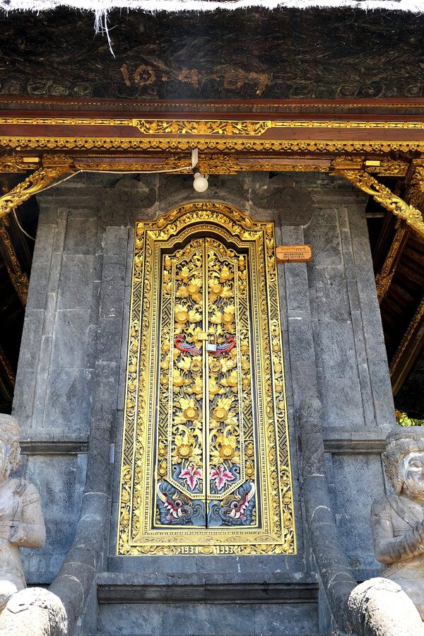 Carved golden doors of Pura Silayukti temple in Padangbai Bali
