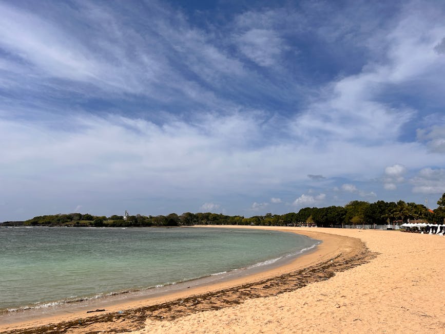 Tranquil sandy beach with calm sea in Bali