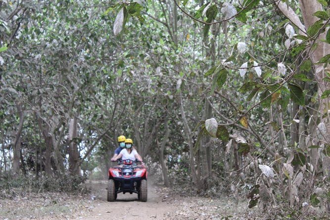 Bali Atv Riding through Cave and Waterfall - Jungle, river, and waterfall: where the scenery gets hands-on