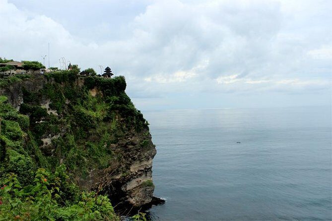 Bali Sunset: Uluwatu Temple, Kecak Dance and Jimbaran - Uluwatu Temple: Arched Gateway, Coral Brick Carvings, and Monkey Reality
