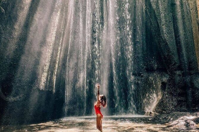 Discover the best waterfalls in Ubud and rice terraces tour - Stop 1: Tukad Cepung Waterfall and its jungle-valley light