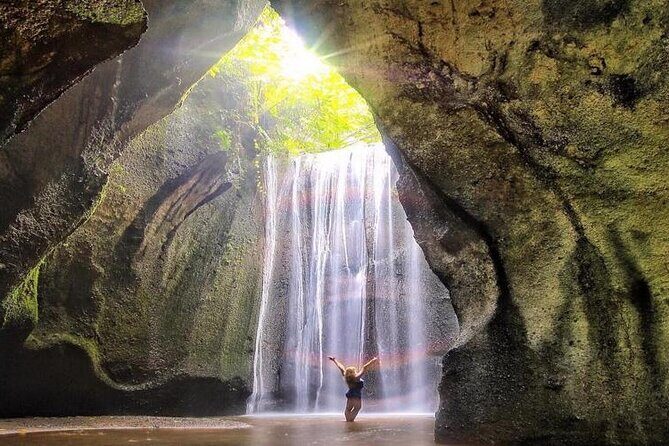 Discover the best waterfalls in Ubud and rice terraces tour - Stop 2: Kanto Lampo Waterfall with the river-under-the-falls look