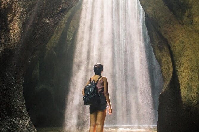 Eastern Bali and Besakih Temple Tour - Tukad Cepung waterfall: a cave-water scene that rewards timing