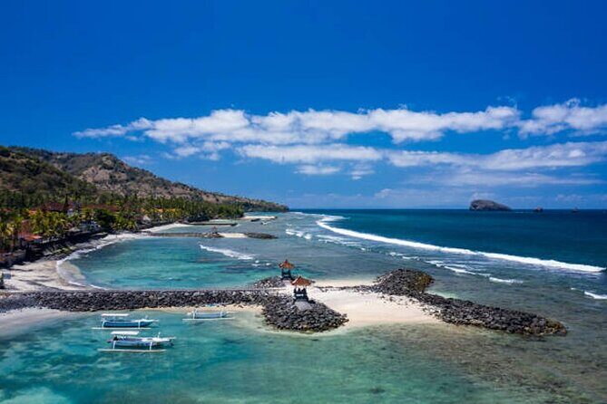 Full Day Private Tour East Bali Sightseeing - All Inclusive - Taman Ujung Water Palace: pools, old structures, and Mount Agung framing