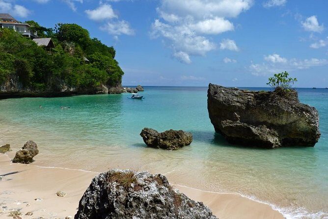 Private Tour Bali Beaches and Uluwatu Temple with Dinner - Pandawa Beach: Rocks, Sightseeing, and a More Relaxed Swim Break
