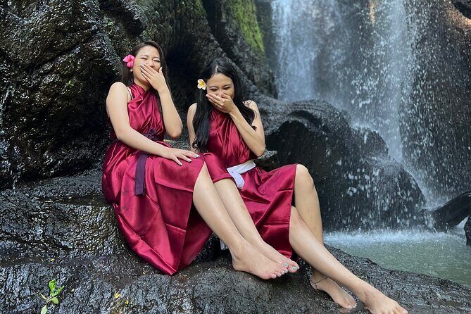 Purifications at Beji Griya Waterfalls - Offerings, young coconuts, and the priest who keeps it correct