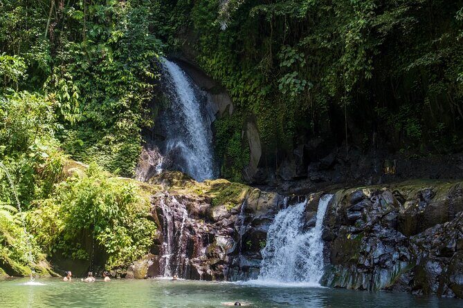 Swimming At Taman Sari Waterfall & Visit The Best Site Of Ubud - Puseh Batuan Temple: carved details in a village setting