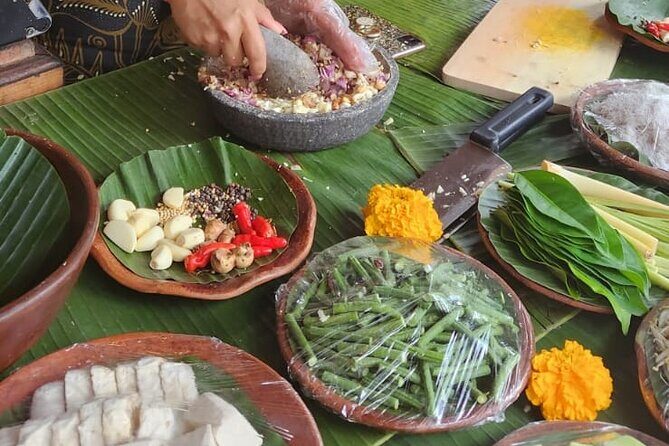 Traditional Balinese Cooking Class with Ubud Tour - Picking herbs by bicycle, then dressing for the class