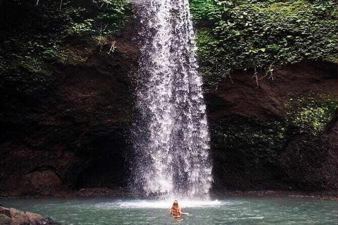 Ubud Full Day - Monkey Forest, Rice Terrace and Waterfalls Tour - Kanto Lampo Waterfall: fresh mountain water and rock formations